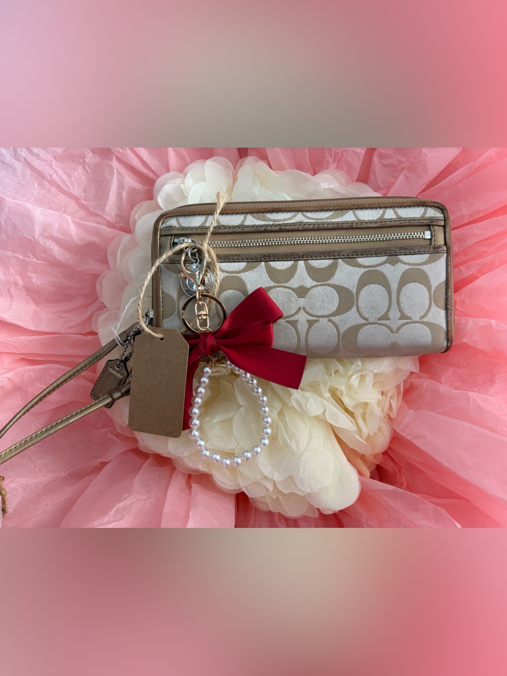 Coach Beige Signature Canvas Wristlet with Brown Bow and Pearl Accent